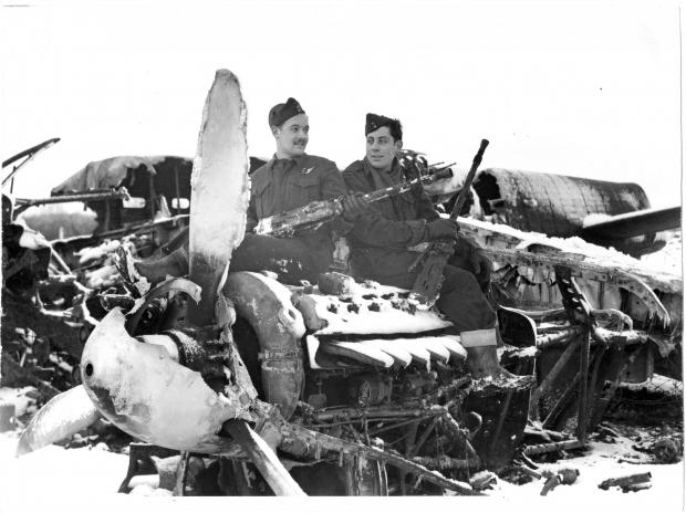 The Northern Echo: Two Canadian airmen pose amid the wreckage of KB-700 at RAF Middleton St George in 1945. Picture courtesy of Geoff Hill