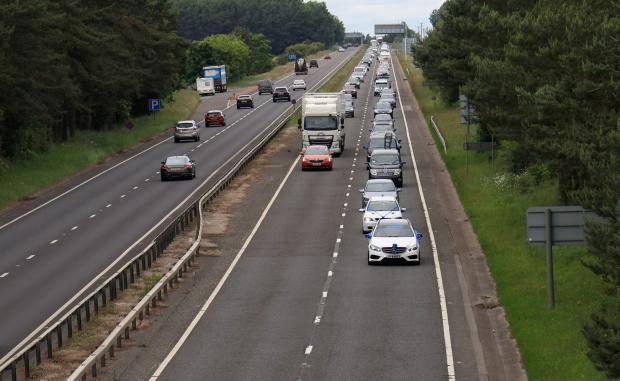 The Northern Echo: The convoy heading south through Seaton Burn. Picture: NORTH NEWS