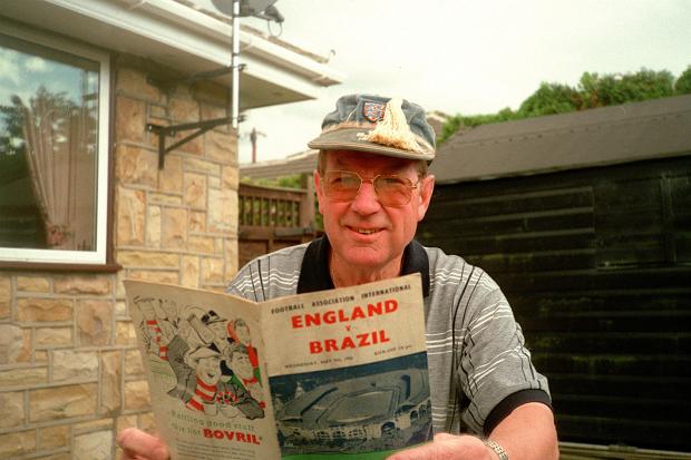 Colin Grainger, pictured in 2000 with the programme from his international debut in the 1950s