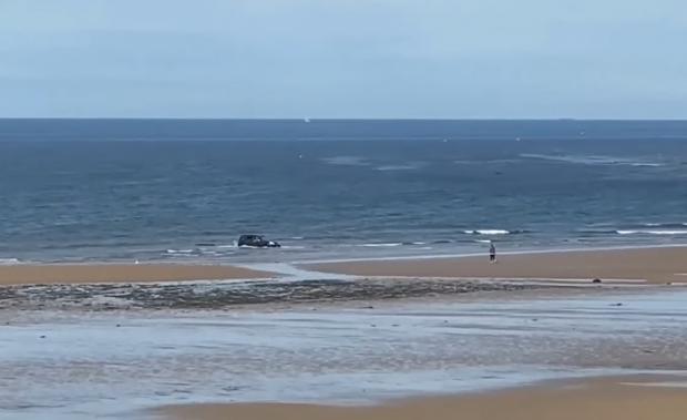 The Northern Echo: The car gets submerged at Saltburn beach on Tuesday (June 21). Picture: INCIDENTS ON TEESSIDE & COUNTY DURHAM 