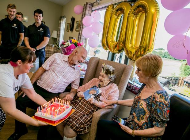 The Northern Echo: Louie Young is celebrating her 100th birthday at Appleton Lodge in Spennymoor, she is pictured with her son Malcolm and daughter in law Therasa Picture: SARAH CALDECOTT