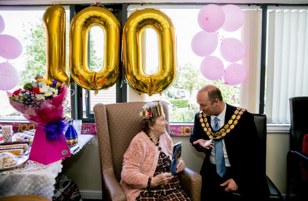 The Northern Echo: Louie Young is celebrating her 100th birthday at Appleton Lodge in Spennymoor, she is pictured with the Mayor Dean Ranyard Picture: SARAH CALDECOTT