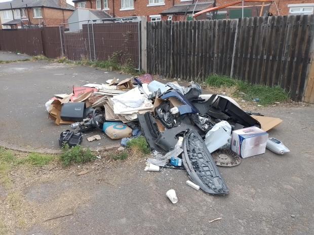 The Northern Echo: Household and business waste, car parts and containers were dumped to the rear of Thorndyke Avenue in Middlesbrough Picture: Middlesbrough Council