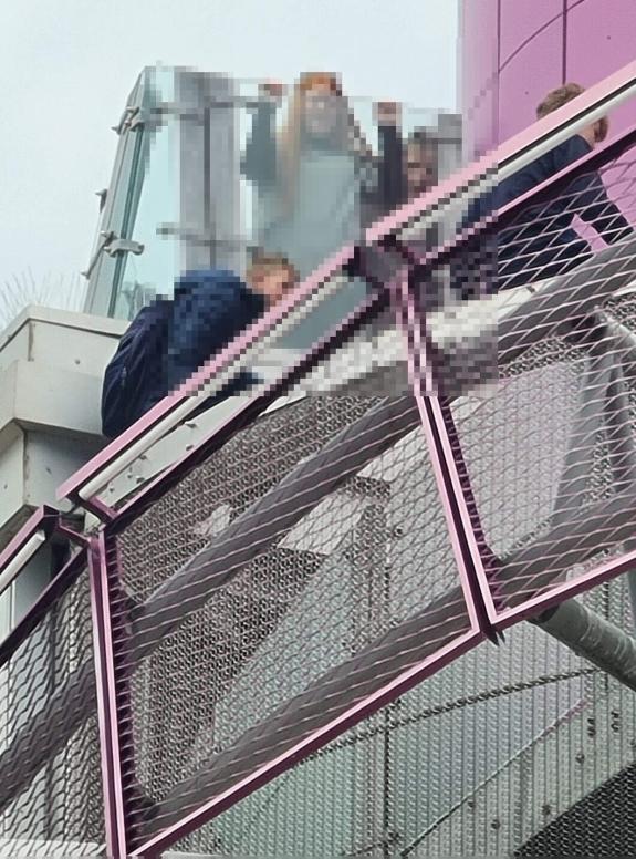 The Northern Echo: Children climbing over the safety rails at Redcar Beacon The Northern Echo: Children climbing over the safety rails at Redcar Beacon