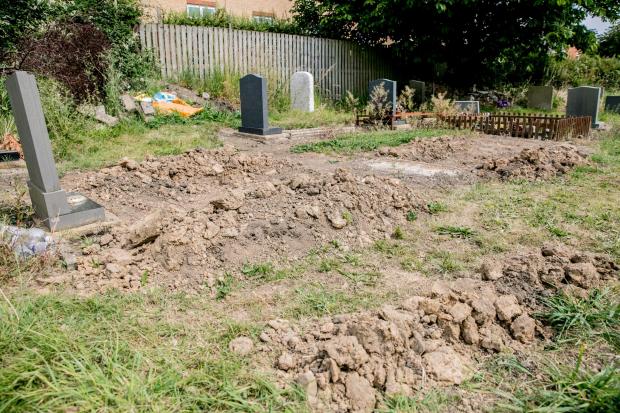 The Northern Echo: Six plots have had to be dug up in the search for Thomas' coffin. Picture: SARAH CALDECOTT