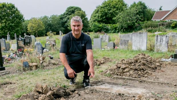 The Northern Echo: Tom Bell, at the grave he believed his dad was buried at for 17 years. Picture: SARAH CALDECOTT