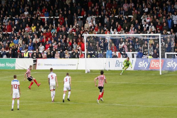 Elliot Embleton fires home from the penalty spot at the Suit Direct Stadium