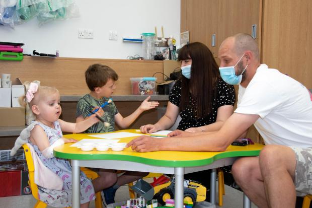 The Northern Echo: Grace, Josh, Becci and Darren painting in the playroom at the Freeman Hospital. Picture: NHS