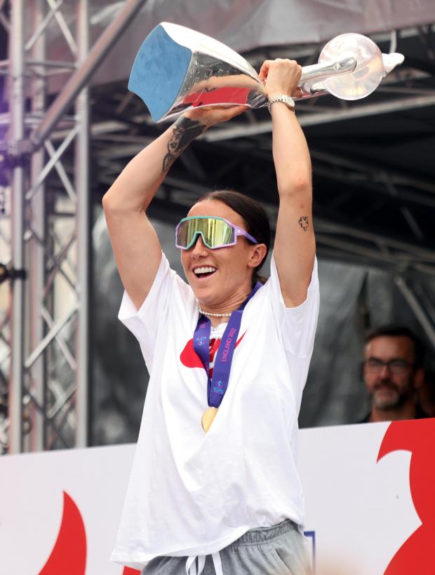 The Northern Echo: England's Lucy Bronze with the trophy on stage during a fan celebration
