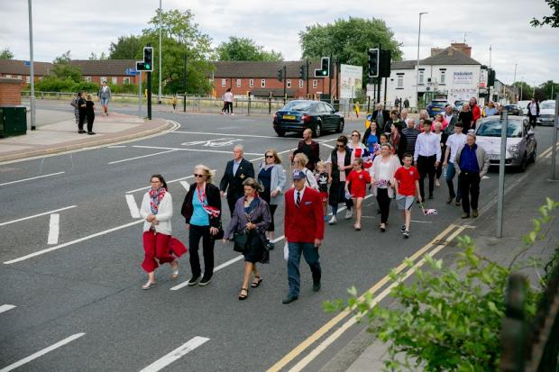 The Northern Echo: Mourners wearing union flag colours. Picture: SARAH CALDECOTT