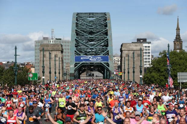 The Northern Echo: The bridge makes for an iconic image every year as the Great North Run descends on Tyneside. Picture: TOM BANKS