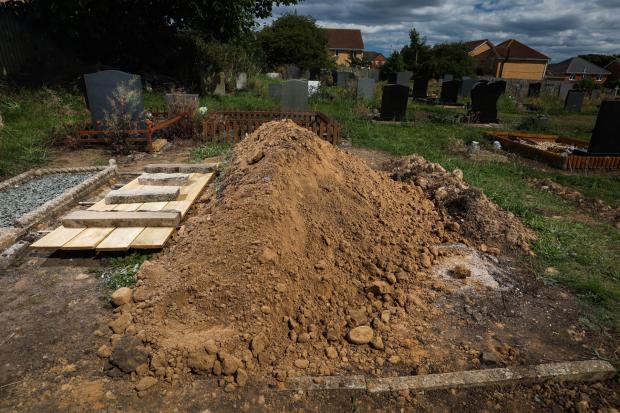 The Northern Echo: To the left wood covers the grave where Thomas Bell has been buried for the last 17 years. Just two meters to the right is where the family believed he was buried. Picture: CHRIS BOOTH