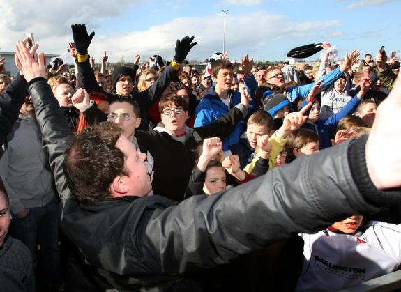 The Northern Echo: Darlington fans celebrate at becoming champions of the Northern League after their 3-1 victory over Team Northumbria. The Northern Echo: Darlington fans celebrate at becoming champions of the Northern League after their 3-1 victory over Team Northumbria.