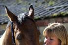 Nicola Garbutt with her horse Chezney who had to have an eye removed after being shot by an air-gun