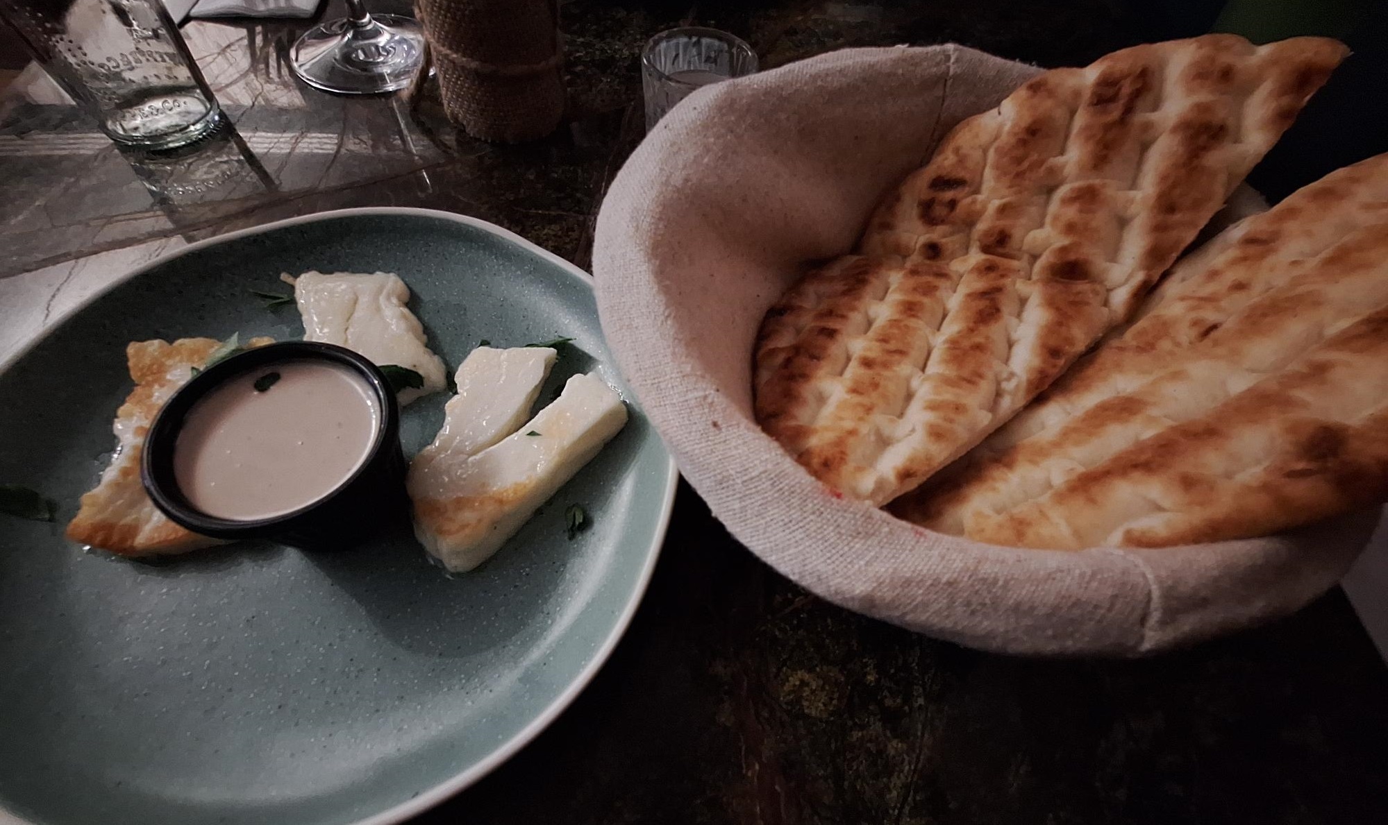 The grilled halloumi starter with tahini and bread straight from the oven