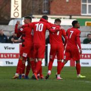 Darlington celebrate their first goal at Blyth on Saturday. Picture: CHRIS BOOTH