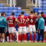 Neil Warnock speaks to his players in the wake of Middlesbrough's crucial 2-1 win at Reading on Tuesday night