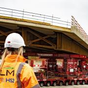 A 128-wheel hydraulic platform moves the 150 metre span bridge into place