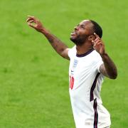 Raheem Sterling celebrates after scoring England's winner