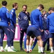 England manager Gareth Southgate talks with skipper Harry Kane during a training session at St George's Park earlier this week Picture: MARTIN RICKETT/PA WIRE