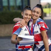 Olympic medal winning twins Jessica, left, and Jennifer Gadirova celebrate their GCSE results at Aylesbury Vale Academy in Buckinghamshire