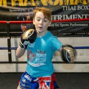 Ten-year-old Theo Spinks will compete for a world title in Bangkok