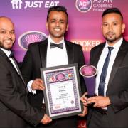 The team at Delhi 6 celebrating their award for the best Asian Restaurant of the Year 2021.