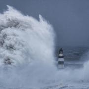 Huge waves crash against the lighthouse in Seaham Harbour, County Durham, in the tail end of Storm Arwen.