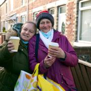 Tracey Metcalfe (left) and her friend Susan Sowerby (right) warm up from the cold with a cup of tea. Photo: Sarah Caldecott.