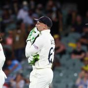 Jos Buttler (left) shows his disappointment after dropping a catch on the opening day of the second Test against Australia