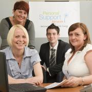 Lisa McCallay, front left, and Tracey MacPherson, front right, of Personal Support Network with Karen Jones and David Dixon of Business Link.