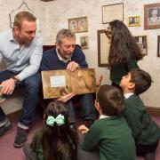 Michael Rosen and Sir Chris Hoy at a World Book Day event in 2016 (PA)