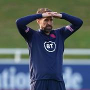 England manager Gareth Southgate watches his team in training.