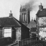 The burning church tower from Marske High Street 120 years ago