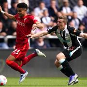Newcastle United’s Matt Targett tries to stop Liverpool’s Luis Diaz on Saturday. Picture: PA
