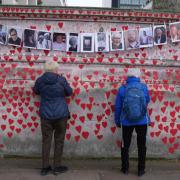 The National Covid Memorial Wall opposite the Palace of Westminster in central London (Victoria Jones/PA)