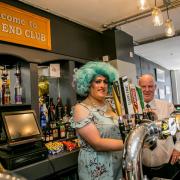 Miss Annbag (aka Peter Miller pulling the first pint with manager Paul Gill at East End Club Picture: SARAH CALDECOTT