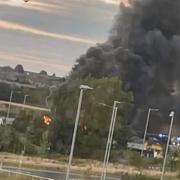 Emergency services were called to the Integra 61 site in Bowburn, Durham, at around 9.30pm after members of the public reported seeing black plumes of smoke coming from industrial land to the west of the Amazon site Picture: TEESSIDE & COUNTY DURHAM