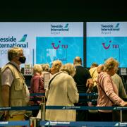 Passengers queueing at Teesside International Airport. Picture: SARAH CALDECOTT