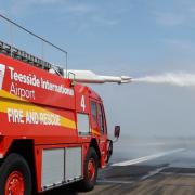 A Teesside Airport Fire and Rescue vehicle dousing the runway