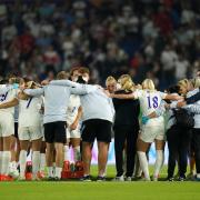 England's players and staff form a huddle after their semi-final win over Spain at Women's Euro 2022. Picture: ADAM DAVY/PA