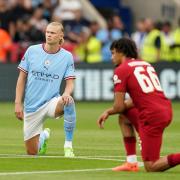 Manchester City's Erling Haaland and Liverpool's Trent Alexander-Arnold taking a knee before the FA Community Shield (PA)