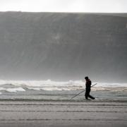 TESTING THE WATER: A man wades into the sea at Saltburn beach