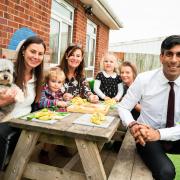 PM Rishi Sunak with Alice McCullagh (left), and Rosedene Nursery staff and children.