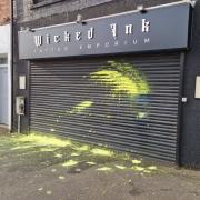 A Darlington tattoo parlour was covered in paint last weekend after vandals allegedly defaced the store Credit: MICHAEL ROBINSON