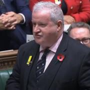 Ian Blackford was seen wearing a black and yellow badge during PMQs