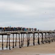 A Surfers Against Sewage protest at Saltburn Pier in 2021