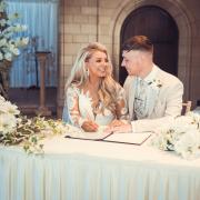 Ell and Brad Saunders sign the register at their recent wedding at Sneaton Castle, Whitby
                                                Picture: ELL and BRAD SAUNDERS