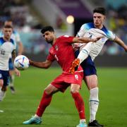 Declan Rice challenges Mehdi Taremi during England's 6-2 win over Iran on Monday