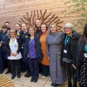 Beth Robinson and her assistant Tracey Crammond with Friarage staff at the hospital's new secret garden